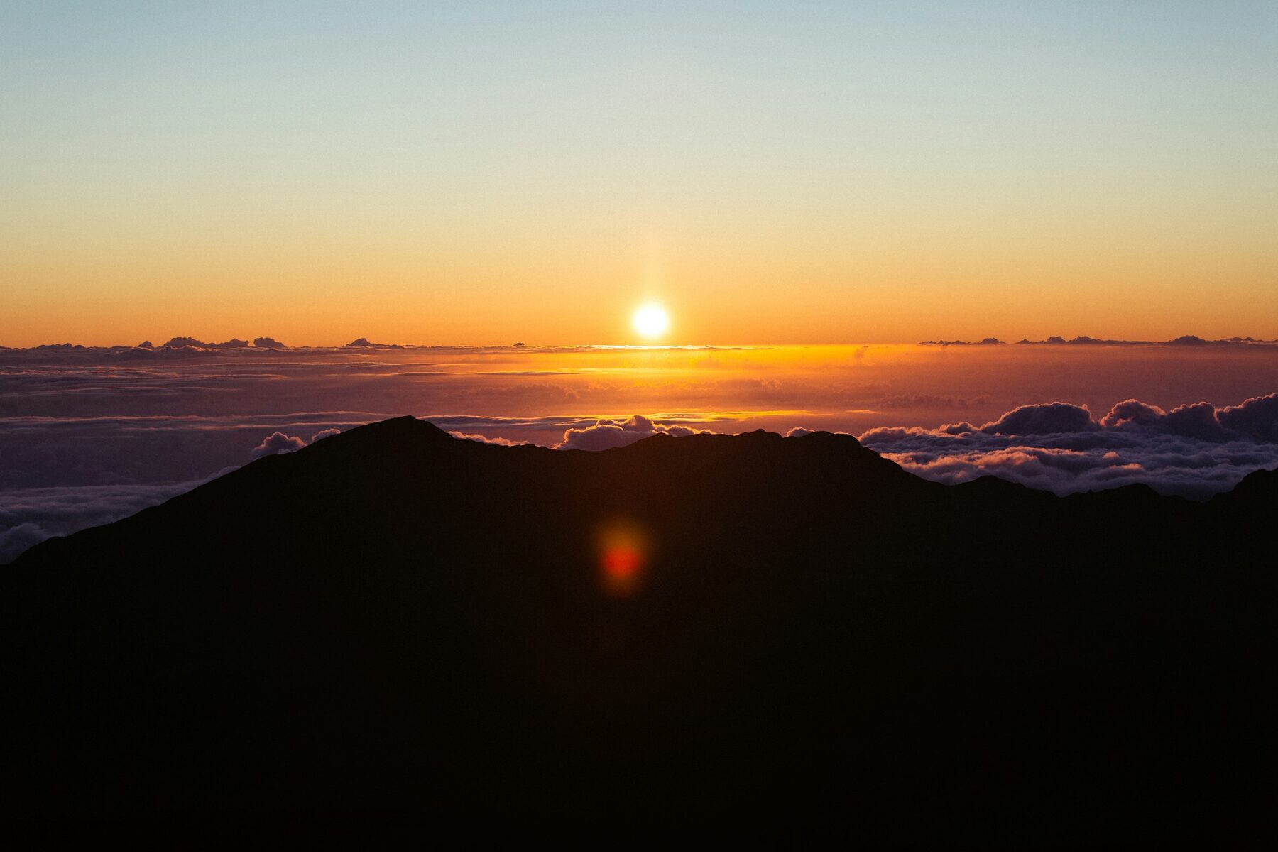 Sunrise above the clouds at Haleakalā